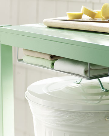 Attach a letter tray to the underside of the counter with four cup hooks to hold dish towels. Attach a letter tray to the underside of the counter with four cup hooks to hold dish towels.
