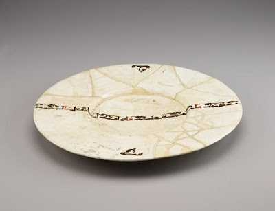 Dish | Origin:  Iran | Period: 10th century  Samanid period | Details:  Not Available | Type: Earthenware painted over glaze | Size: H: 5.0  W: 42.7  cm | Museum Code: F1954.16 | Photograph and description taken from Freer and the Sackler (Smithsonian) Museums.