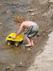 Hey, little boy.  We like to play with trucks.  May we play with you?