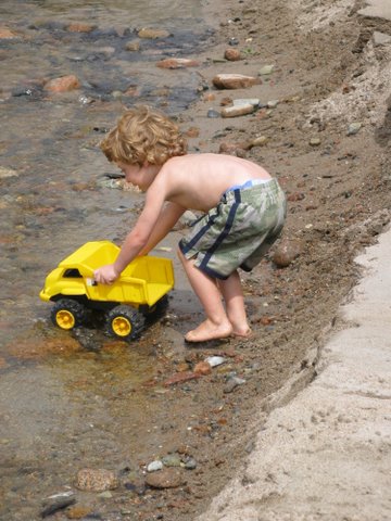 Hey, little boy.  We like to play with trucks.  May we play with you?