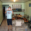 Roy. Loves taking pictures. He's 20. Looks like he's 16.