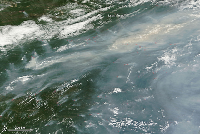 A thick curtain of smoke hangs over the forests of Siberia in this natural color image taken by the Moderate Resolution Imaging Spectroradiometer (MODIS) on the Terra satellite on 18 July 2011. Photo: NASA image courtesy the MODIS Rapid Response Team at NASA GSFC.