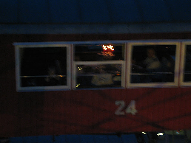 Blurry shot of the opposite gondola, the occupants were eating dinner.