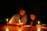 Writing out the nightly posting by candlelight when the generator goes out, Abra Patricia Lodge, Peru