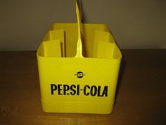 Vintage Pepsi-Cola bottle holder in yellow