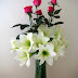 Pink roses and lilies in one vase