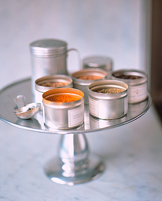 Keep all of the spices you need on hand next to the stove or a prep area with a cake stand.