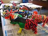 A row of rhinos on display while their paint is drying. Transition to Madagascar - 092.jpg