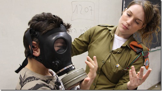 вЂњThe Work of an IDF Emergency InstructorвЂќ, January 19, 2012. Every day, Israeli citizens must cope with the potential daily threat of rocket fire from the Gaza Strip.<br />Just last year, in 2011, Hamas fired 627 rockets and mortars from Gaza into Israel. In order to ensure security for all Israeli civilians, the IDF dispatches Emergency Situations Instructors to day schools, instructing the children how to protect themselves in case of emergency. In the picture is Cpl. Noy Eisen, teaching the children of Holon on proper procedures in emergency situations that can arise in Israel.