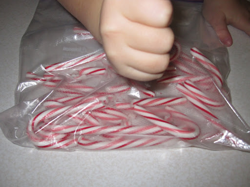 She started by pounding the bag with her fist to break up the candy canes. Ouch! Not the ideal technique.