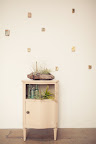 A small cabinet like this one decorated with bottles and a nonfloral centerpiece would be a great accent in a cocktail area. A small cabinet like this one decorated with bottles and a nonfloral centerpiece would be a great accent in a cocktail area.