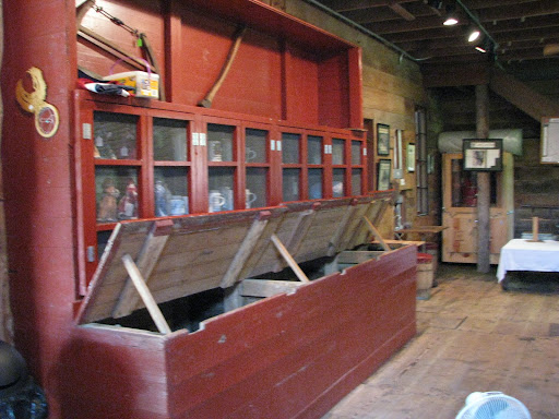These wooden storage units were once the place to store grain. (Photo credit:  Emma Wilson)
