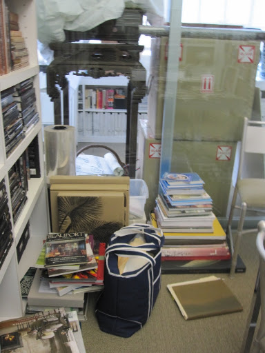 A corner of my office has a pile of books and folders for various projects I am working on.