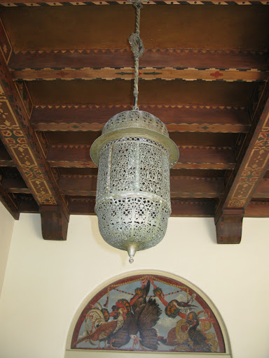 I love how this Indian-inspired light fixture mixes with the ceiling fixture and painting.