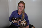Kelly with her current foster crew: a mama beagle rescued from a horrific illegal breeding operation and her three pups.