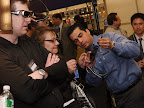 A Panasonic representative explains the 3D Active Shutter glasses to members of the media.