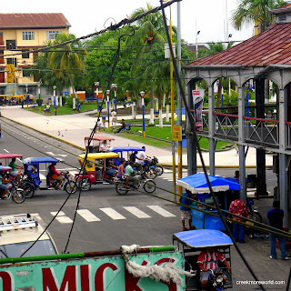 The house on the right is constructed entirely of iron, a tourist 'attraction' of Iquitos.