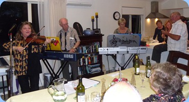 Left to Right: Marian Burns, Peter Brophy, Jan Johnston and Kevin Johnston accomanying with a percussive instrument/shaker