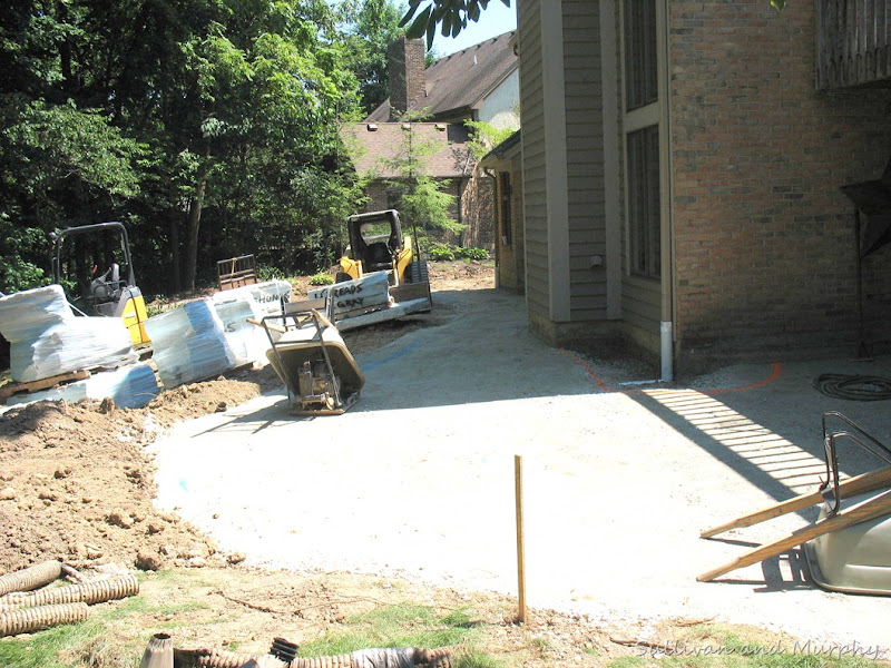 yard full of loaders and stone