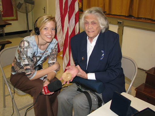 Young displays her Congressional Medal of Honor during an interview with KSMU's Jennifer Moore.