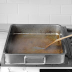 After roasting, transfer turkey to a cutting board and let rest. Place roasting pan with drippings across two burners and simmer juices, stirring with a wooden spoon, until liquid thickens and holds a trail (8-10 minutes). After roasting, transfer turkey to a cutting board and let rest. Place roasting pan with drippings across two burners and simmer juices, stirring with a wooden spoon, until liquid thickens and holds a trail (8-10 minutes).