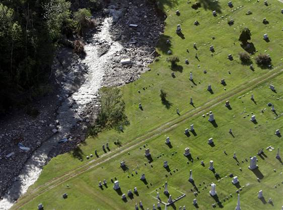 Aerial view of flood damage to the cemetery with uncovered coffins on 30 August 2011 in Rochester, Vermont. Toby Talbot / AP