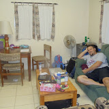 Lounging on the couch in our living (and dining) room.