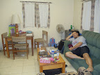 Lounging on the couch in our living (and dining) room.