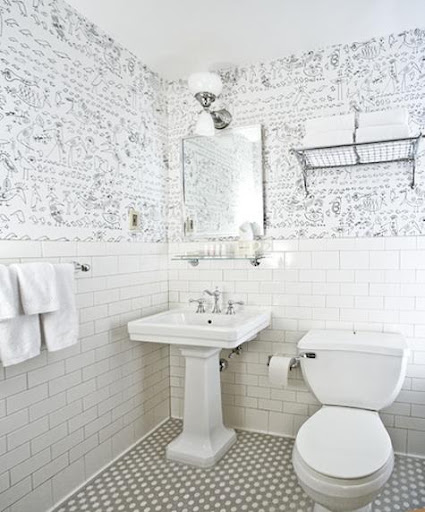 Wallpaper adds a bit of interest in this bathroom (designed by William Sofield for the Soho Grand Hotel).