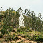 White statue thing on big hill.