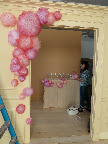 The opening shot starts coming to life. That's Erin Furey in the background, decorating the table.