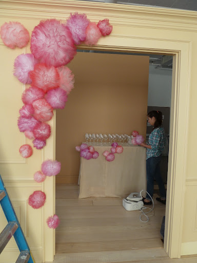 The opening shot starts coming to life. That's Erin Furey in the background, decorating the table.
