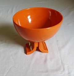 Small orange plastic footed bowl