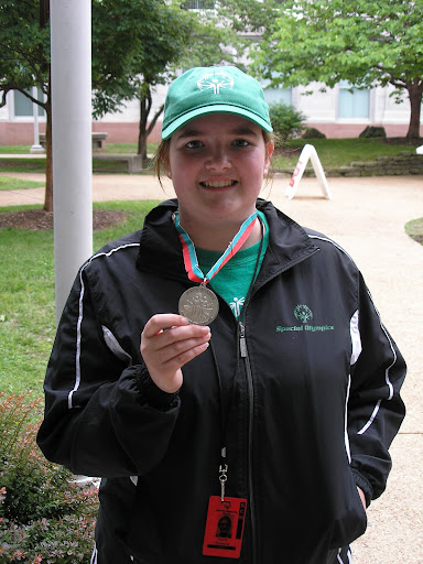 Special Olympics participant Sierra Simmons and her winning medal.
(Photo credit: Jeremy Shreckhise)