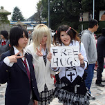 Japanese girls holding a Free Hugs sign in Harajuku, Japan 