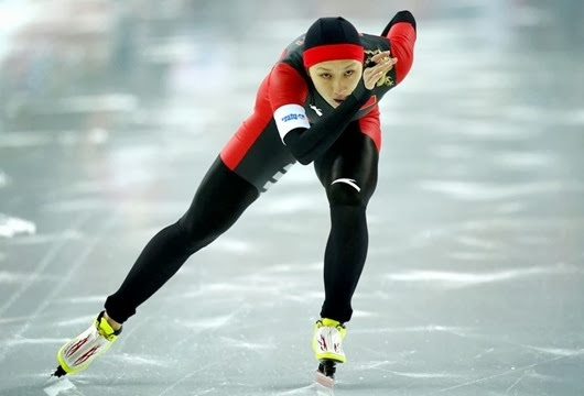 REFILE - CORRECTING IDENTITY    China's Zhang Hong competes in the women's 1,000 metres speed skating event during the 2014 Sochi Winter Olympics, February 13, 2014.                REUTERS/Issei Kato (RUSSIA  - Tags: OLYMPICS SPORT SPEED SKATING TPX IMAGES OF THE DAY) ORG XMIT: OLYJ6007