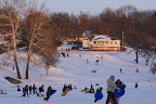 The sun may be setting, but that doesn't stop sledders from having a good time.