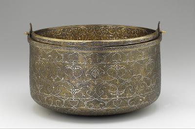 Bucket | Origin:  Venice,  Italy | Period: mid-16th century | Details:  Not Available | Type: Bronze inlaid with sliver | Size: H: 32.2  W: 30.2  cm | Museum Code: F1945.14 | Photograph and description taken from Freer and the Sackler (Smithsonian) Museums.