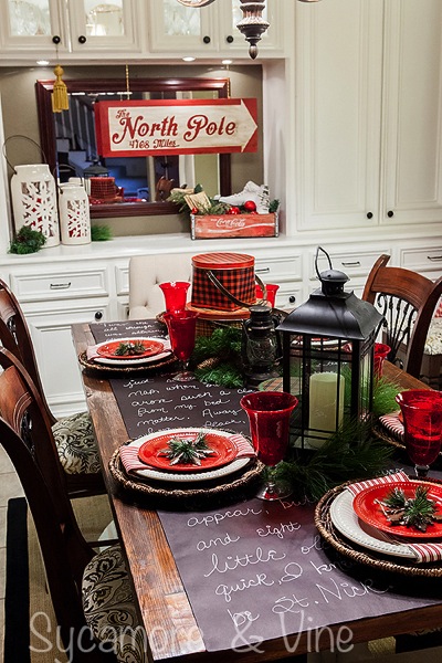 Vintage plaid tinware and North Pole inspired accents in the dining room. A truly stunning Christmas Home Tour as part of the Christmas in the Country Blog Tour. This Plaid Inspired Country Christmas will knock your socks off. Features tours of the Living room, Dining Room and a Cocoa hot chocolate bar in the Breakfast room. There is so much inspiration for Christmas decorations in this one post. Be prepared to feel like you are cuddled up by the fire in a warm Northwoods comfy cottage! #country #Christmas #Plaid #Holiday decorating #Holiday ideas #Holidays #Christmas decor #Holiday decor Vintage plaid tinware and North Pole inspired accents in the dining room. A truly stunning Christmas Home Tour as part of the Christmas in the Country Blog Tour. This Plaid Inspired Country Christmas will knock your socks off. Features tours of the Living room, Dining Room and a Cocoa hot chocolate bar in the Breakfast room. There is so much inspiration for Christmas decorations in this one post. Be prepared to feel like you are cuddled up by the fire in a warm Northwoods comfy cottage! #country #Christmas #Plaid #Holiday decorating #Holiday ideas #Holidays #Christmas decor #Holiday decor