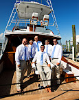 Brad and his groomsmen wore Jos. A. Bank suits and flip flops for his seaside wedding in Florida. They relaxed on a boat in the Destin harbor before the wedding. Brad and his groomsmen wore Jos. A. Bank suits and flip flops for his seaside wedding in Florida. They relaxed on a boat in the Destin harbor before the wedding.