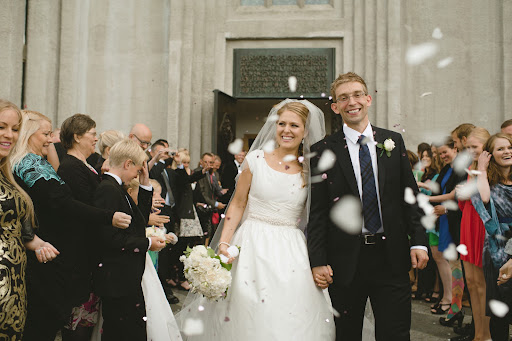 After the ceremony, the newlyweds were showered with heart-shaped confetti, and grinning smiles of the surrounding tourists.