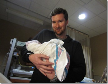 Daddy holding Zoey for the first time