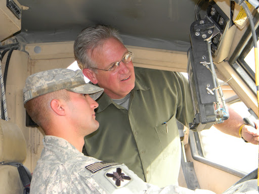 Gov. Jay Nixon visits with a soldier during a demonstration of a Mine Resistant Ambush Protection (MRAP) vehicle in Iraq. (Photo provided by Nixon's Office)
