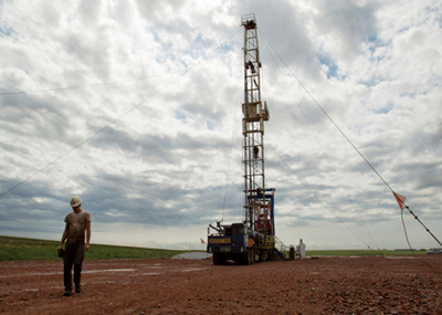 The North Dakota oil boom has brought thousands of jobs and economic prosperity to the region -- along with an increase in crime, pollution, and potential health problems. Gregory Bull / AP Images