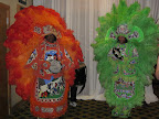Two Mardi Gras Indians danced at the entrance to the party.