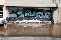 Sandbags and plastic sheet to try and stop the water