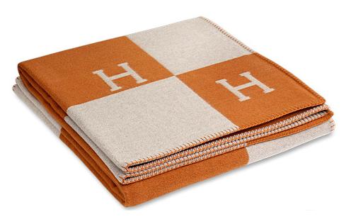 Inspired by a horse blanket, this would be so chic draped over your sofa for the event. (usa.hermes.com)