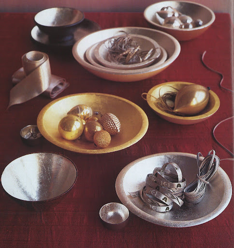 Wood and ceramic bowls are finished with 18-karat yellow-gold leaf and 24-karat white-gold leaf, which actually create a softer effect than silver leaf.