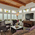 The living room overlooks the garden, patio, marine wildlife and cargo ships.