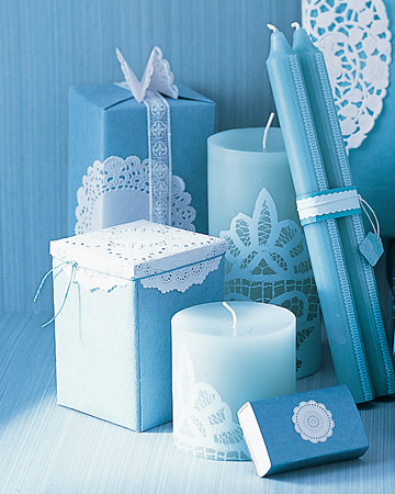 Embellish a plain taper candle with a lacy doily for an elegant effect.